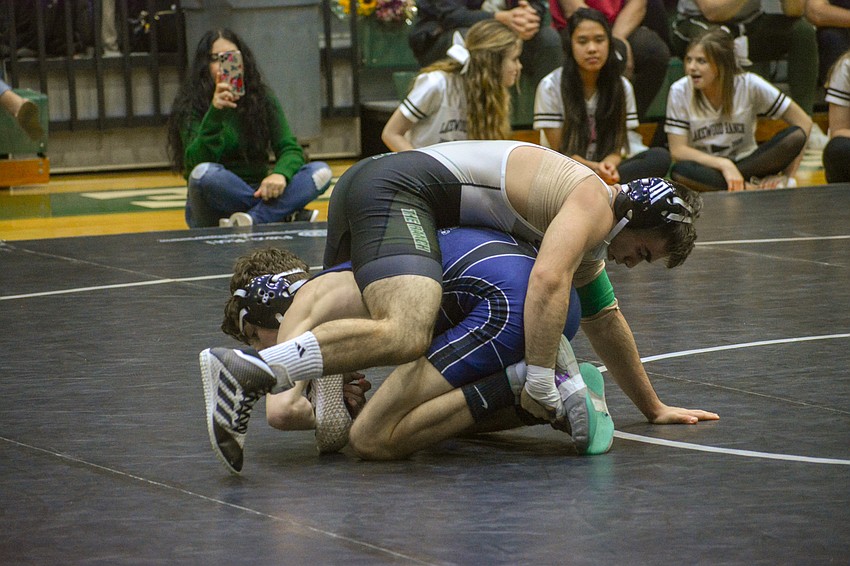 JANUARY — Lakewood Ranch High senior wrestler Jamal Aoudi gets on top of his Sarasota Military Academy opponent. Aoudi, who is 5-foot-6 and 138 pounds, said wrestling helped him get healthy after he weighed as much as 190 pounds.