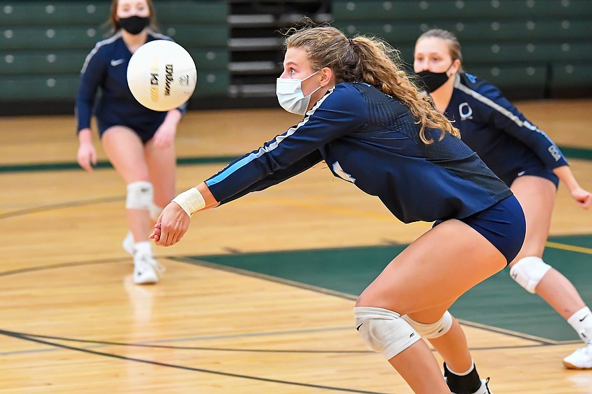 SEPTEMBER — The Out-of-Door Academy senior volleyball player Shelby Fulton wears a mask during a September 16 practice. The team played in masks during matches to comply with school safety regulations. Courtesy photo.