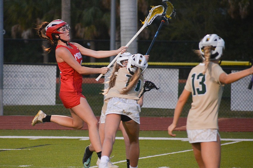 Cardinal Mooney girls lacrosse then-senior Molly Donaghy fires a shot to score a goal March 3 against Saint Stephen's Episcopal. The Cougars would win the game 20-7. They would play one more game before the season ended.