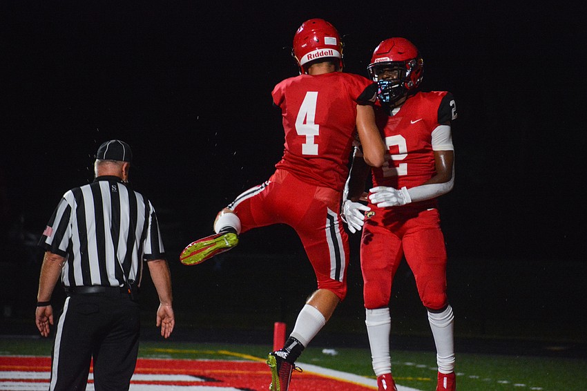 Cardinal Mooney High wideout Hunter Walsh (4) and Lauriel 