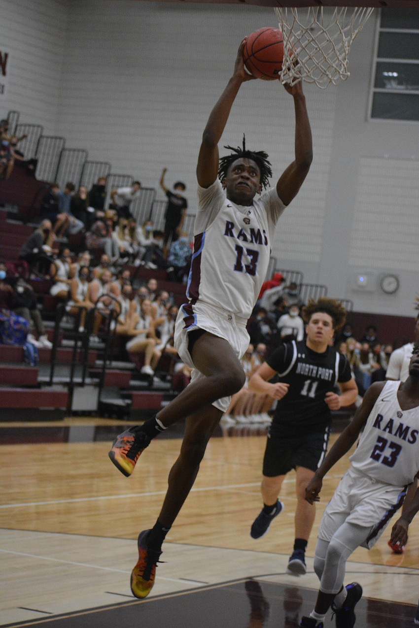 Riverview High boys basketball senior Jayven Millien skies for a dunk Dec. 1 against North Port High. The Rams will lean on veteran players to carry them through the rest of the season. The team was 6-2 as of Dec. 21.