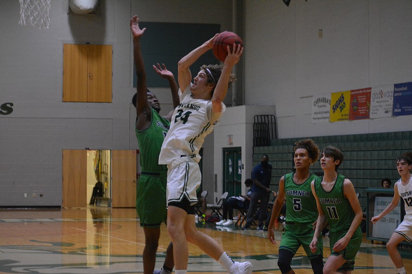 NOVEMBER — Lakewood Ranch High boys basketball junior Andres Junge slices through the Sumner High defense Nov. 19 for an easy score. Lakewood Ranch defeated Sumner 69-49 in a preseason game.
