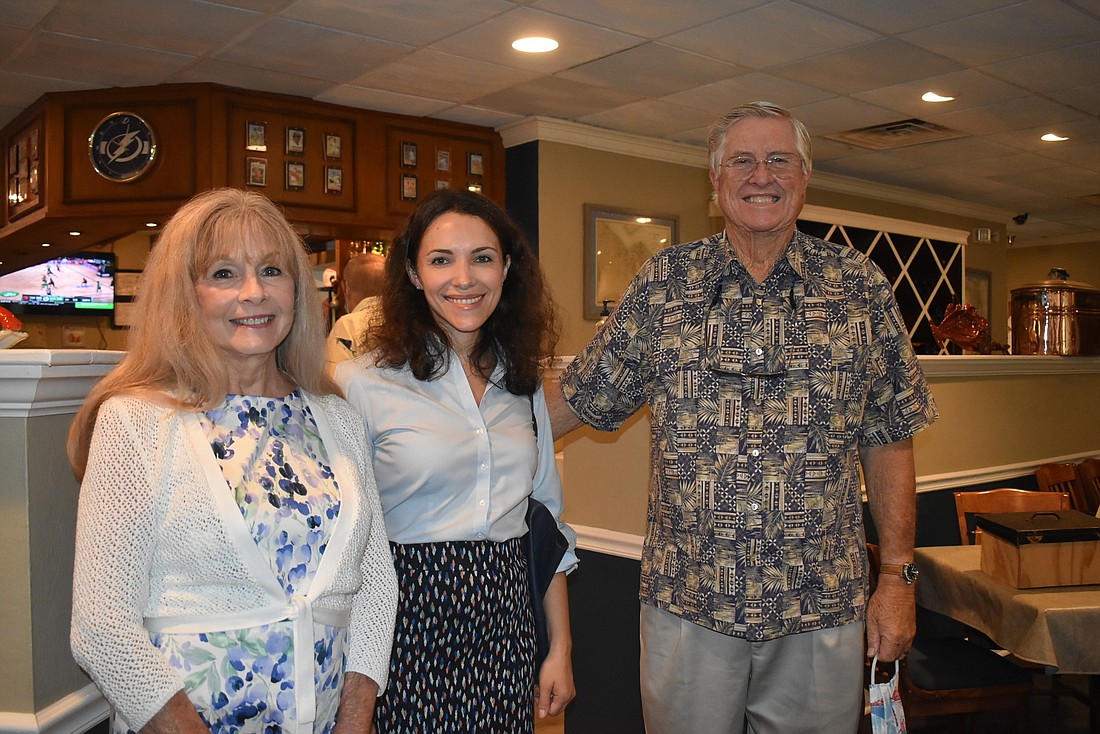 Lynn Larson, Svetlana Kaminsky and Bob Gault at a Kiwanis meeting.