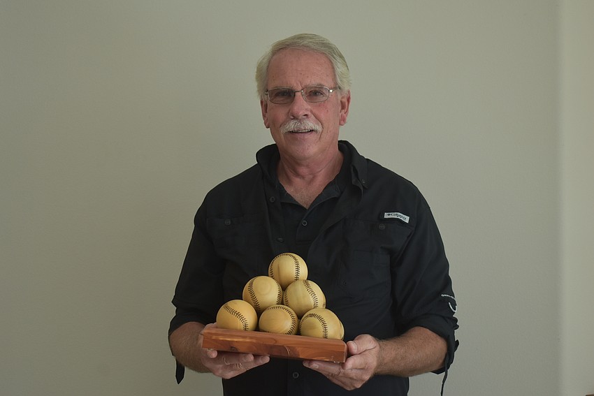 Sarasota resident Marvin Stoltzfus made these decorative baseballs out of Norfolk Island pine.
