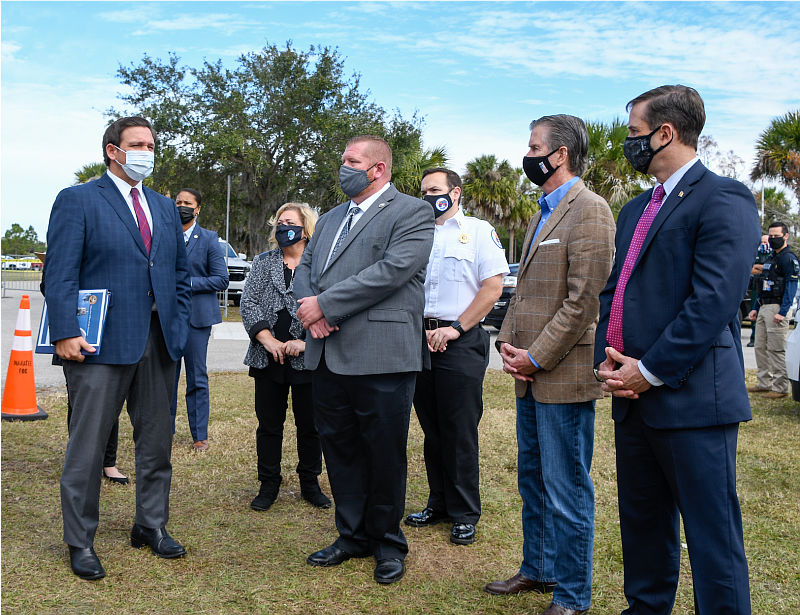 Gov. Ron DeSantis (left) commended Manatee County health and safety personnel on the COVID-19 vaccination program for seniors Thursday at Tom Bennett Park.