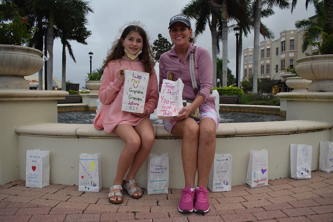River Clubâ€™s Isabella Juliano and her mother, Patricia, make luminarias in honor of friends and family members who have been impacted by cancer.