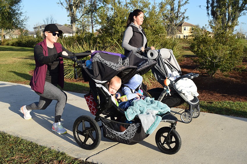Esplanade's RaeAnna Kalkert pushes her children, Hudson and Dakota Kalkert, in a stroller while doing lunges alongside Arbor Grande's Victoria Korotkova and her son, Ian Korotkov.
