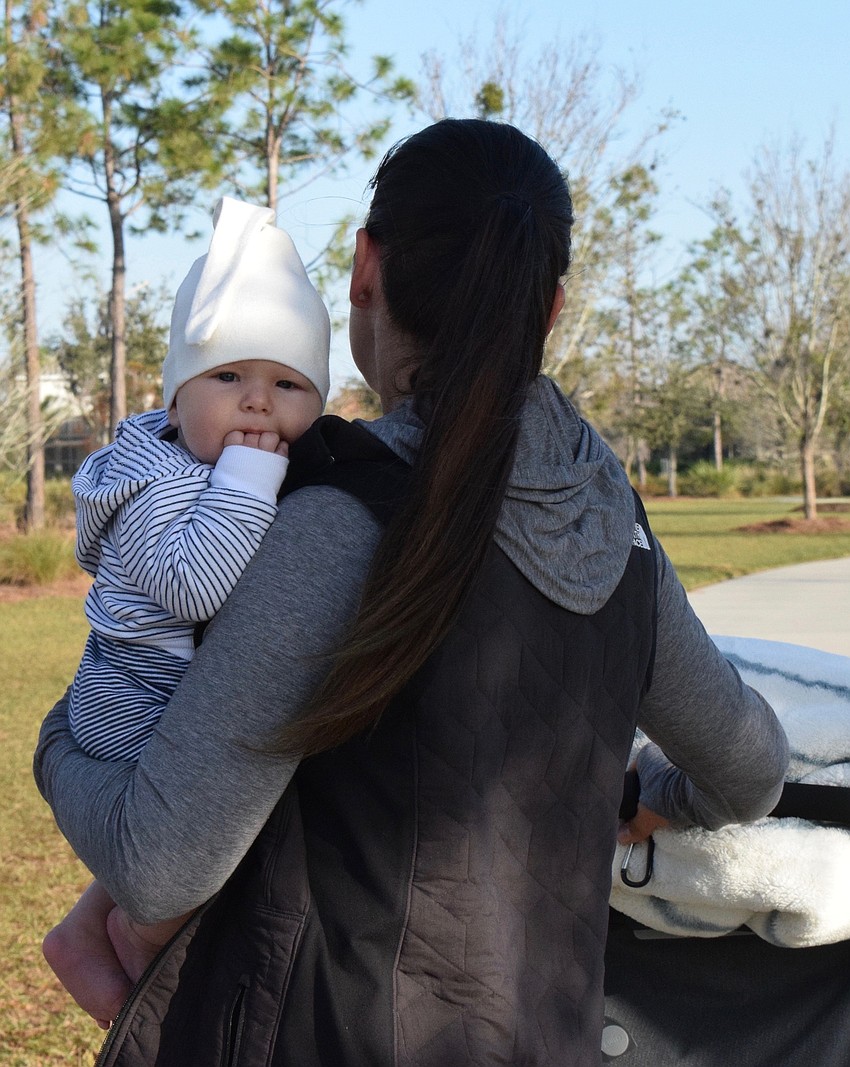 Arbor Grande's Ian Korotkov, who is 3 months old, loves being held by his mother, Victoria Korotkova.