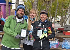 Masters winners Tom Mitchell, left and Linda Bayne, right with organizer Stacey Monroe, center.