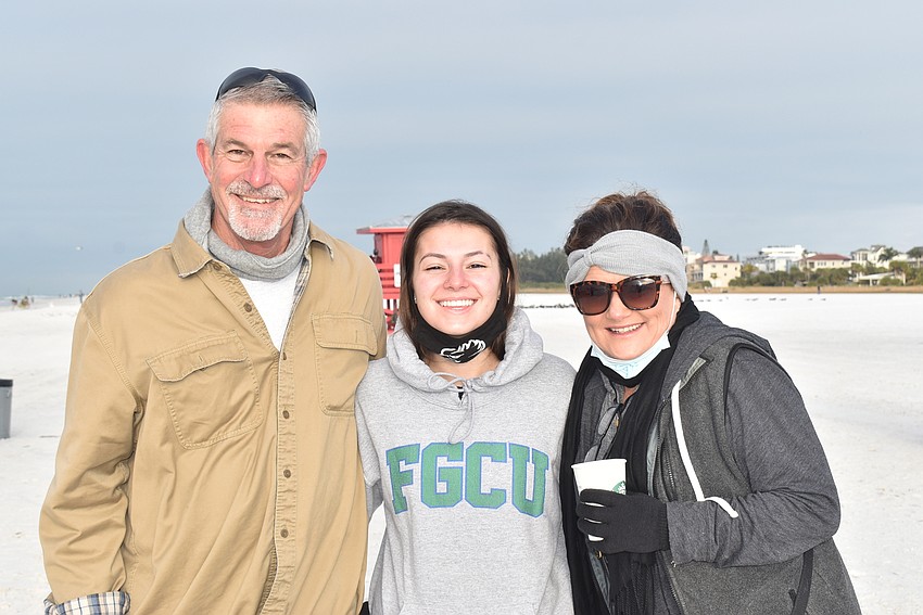 Mark Betten, Alex Cozmer and Helen Briggs spectate.