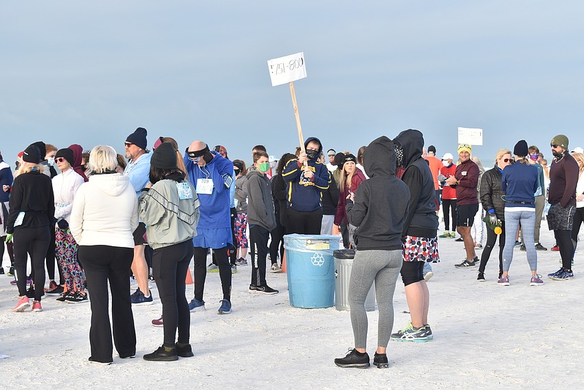 Runners mill around before the start.