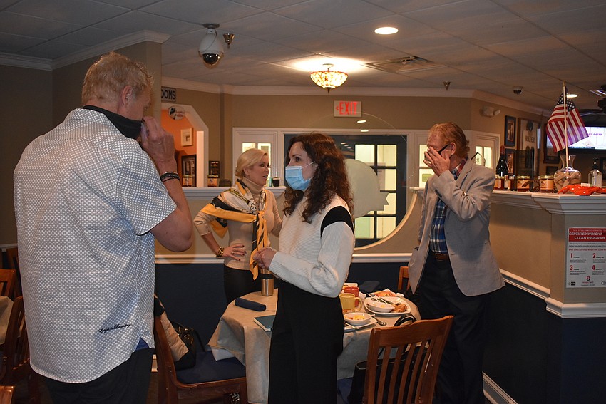 Members mingled after the meeting.