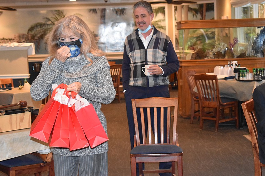 Lynn Larson prepares to hand out bells to four influential ringers.