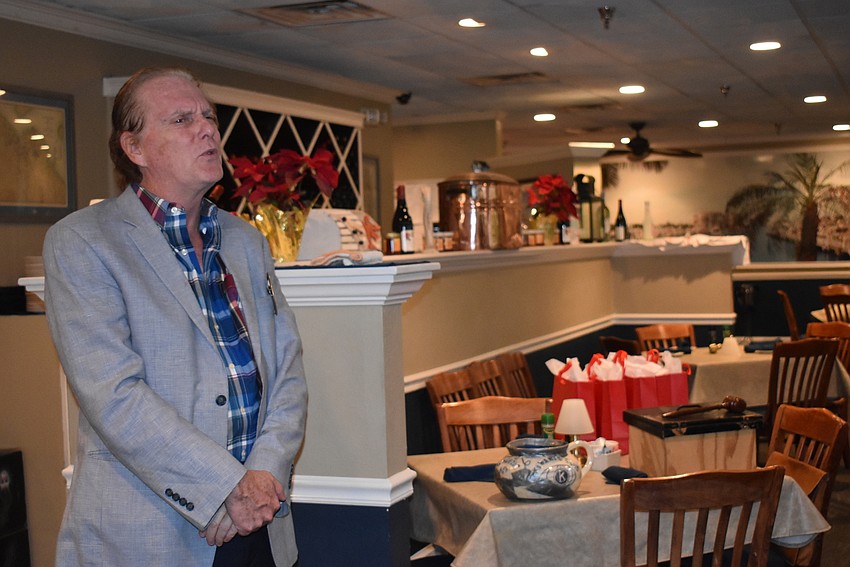 Jim Whitman led the meeting off with a song.