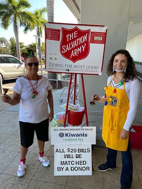 Christ Church of Longboat Key member Ann Quackenbusch and Svetlana Ivashchenko ring the bell outside Publix. Courtesy photo.