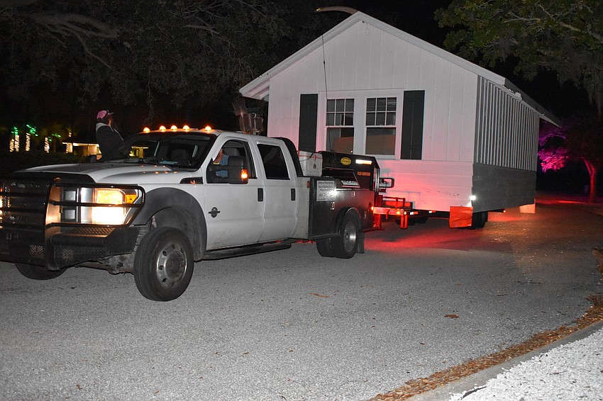 On Wednesday morning, Johnson & Son, Inc. movers moved the historic cottage from 521 Broadway St. to 555 Bay Isles Parkway.
