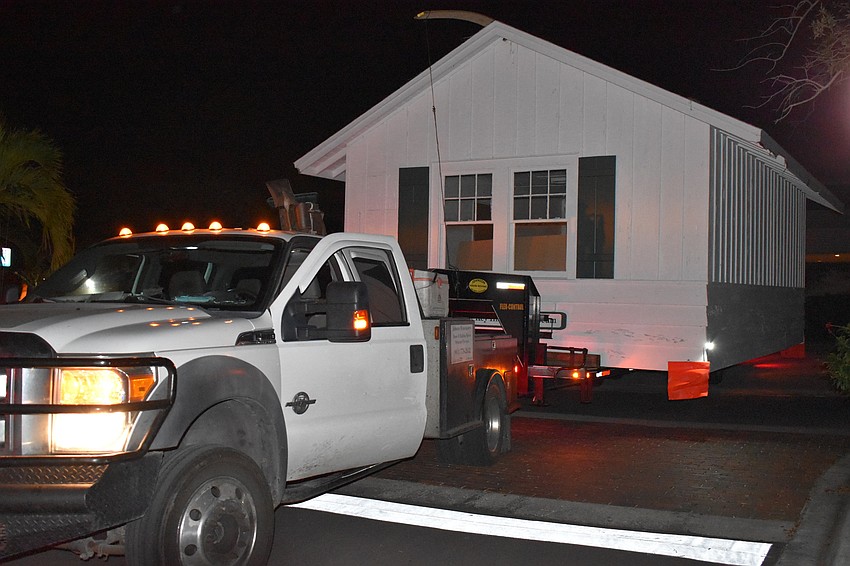On Wednesday morning, Johnson & Son, Inc. movers moved the historic cottage from 521 Broadway St. to 555 Bay Isles Parkway.