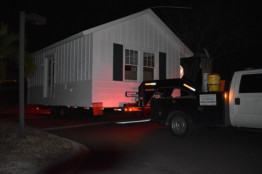 On Wednesday morning, Johnson & Son, Inc. movers moved the historic cottage from 521 Broadway St. to 555 Bay Isles Parkway.