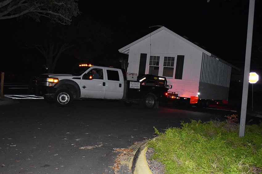 On Wednesday morning, Johnson & Son, Inc. movers moved the historic cottage from 521 Broadway St. to 555 Bay Isles Parkway.