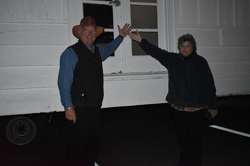 Longboat Key Historical Society President Michael Drake and Treasurer Cathy Meldahl pose for a picture next to the historic cottage.