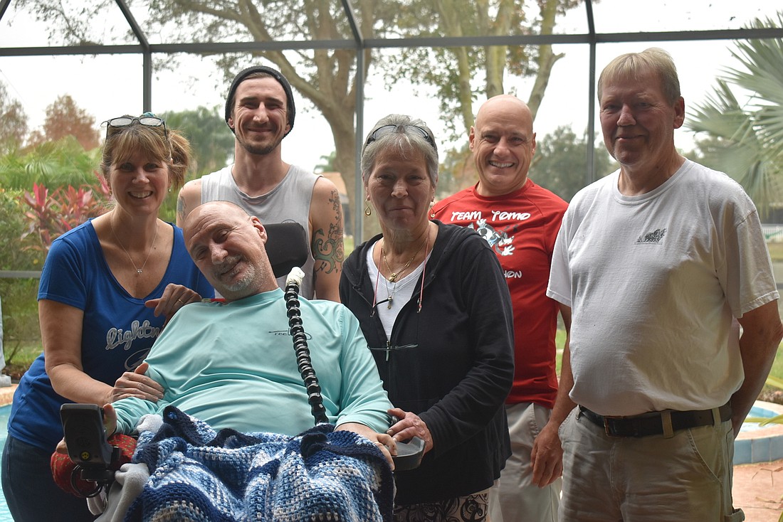 Sue Tomasso, John Tomasso, Nancy Pump, David Tomasso and Harm Pump are among the many loved ones who help take care of Jerry Tomasso, who has ALS.