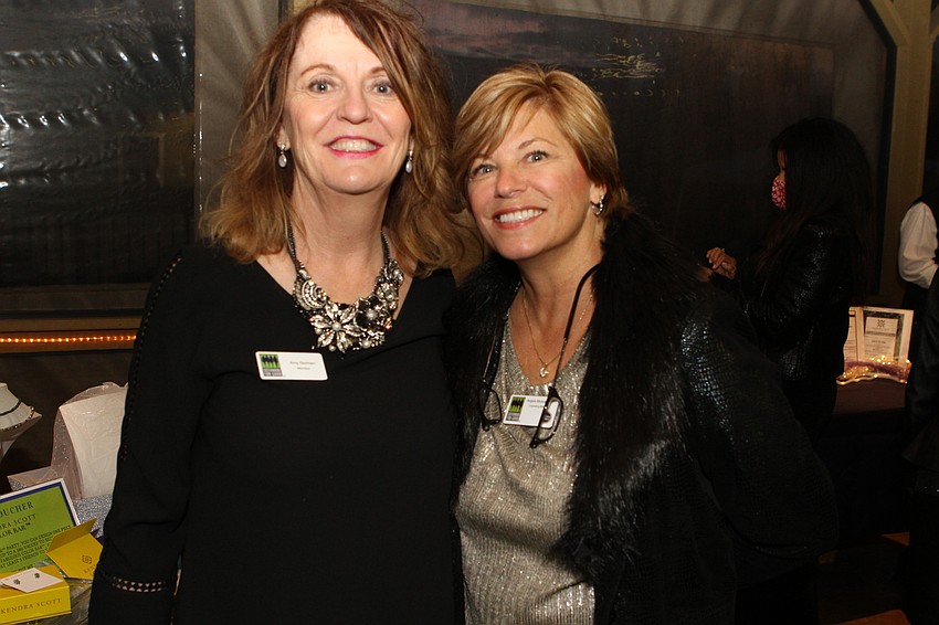 Board chair Amy Gorman and president Angela Massaro-Fain enjoy a moment during the fundraiser.