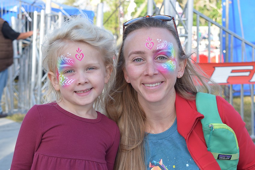 Parrish's Aurora Porcher, who is 5, picks out the face paint to match with her mother, Rachael Porcher. 