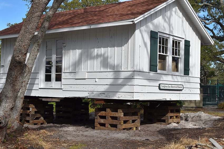 The Longboat Key Historical Society’s cottage is temporarily sitting on cribs. In the coming days, Johnson movers will permanently move the structure to rest on 12 slab piers at 555 Bay Isles Parkway.