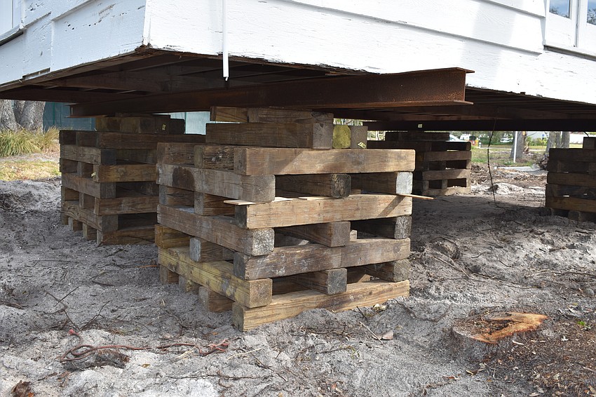 The Longboat Key Historical Society’s cottage is temporarily sitting on cribs. In the coming days, Johnson movers will permanently move the structure to rest on 12 slab piers at 555 Bay Isles Parkway.