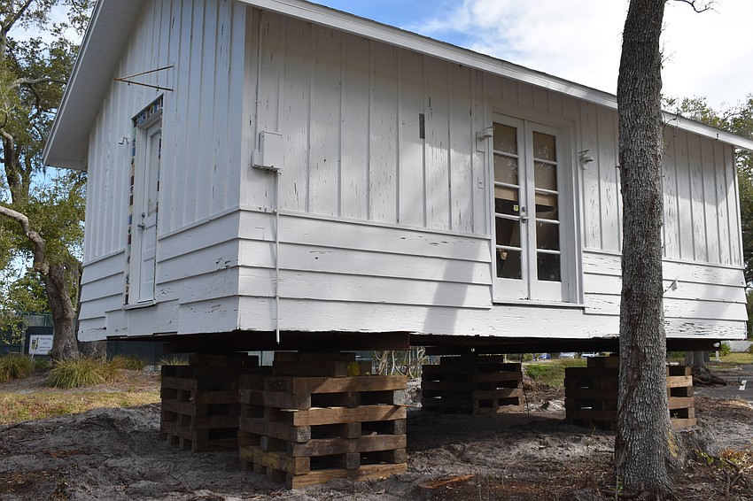 The Longboat Key Historical Society’s cottage is temporarily sitting on cribs. In the coming days, Johnson movers will permanently move the structure to rest on 12 slab piers at 555 Bay Isles Parkway.