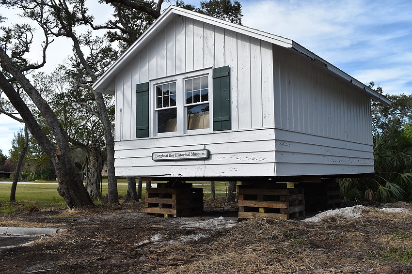 The Longboat Key Historical Society’s cottage is temporarily sitting on cribs. In the coming days, Johnson movers will permanently move the structure to rest on 12 slab piers at 555 Bay Isles Parkway.
