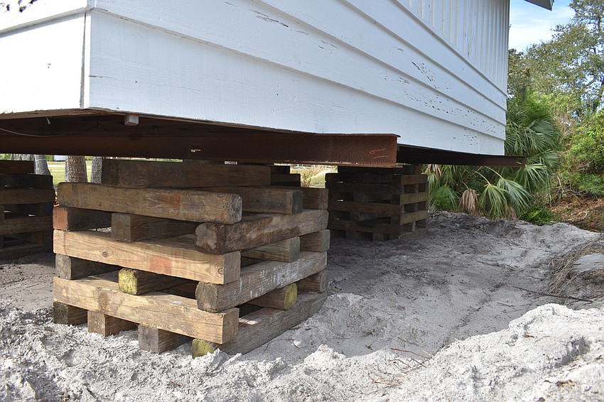 The Longboat Key Historical Society’s cottage is temporarily sitting on cribs. In the coming days, Johnson movers will permanently move the structure to rest on 12 slab piers at 555 Bay Isles Parkway.