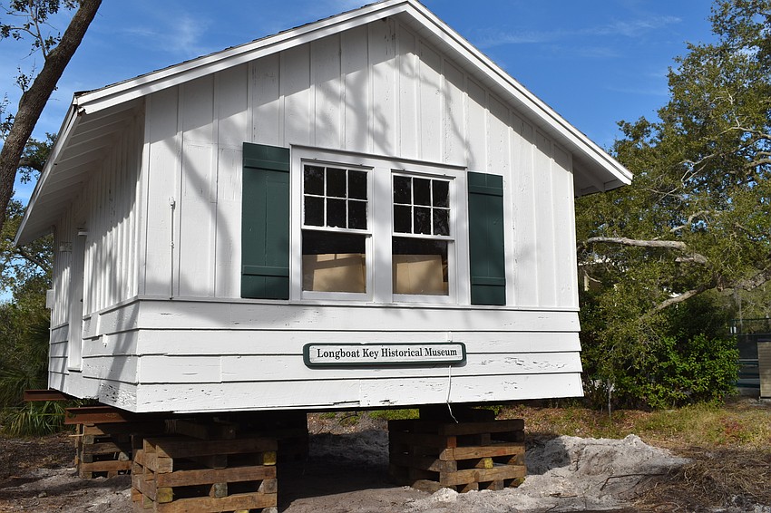 The Longboat Key Historical Society’s cottage is temporarily sitting on cribs. In the coming days, Johnson movers will permanently move the structure to rest on 12 slab piers at 555 Bay Isles Parkway.