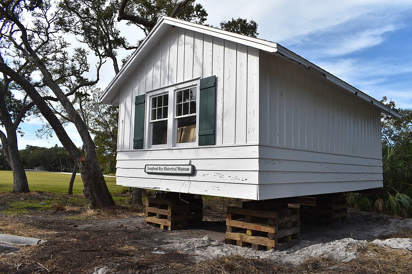 The Longboat Key Historical Society’s cottage is temporarily sitting on cribs. In the coming days, Johnson movers will permanently move the structure to rest on 12 slab piers at 555 Bay Isles Parkway.