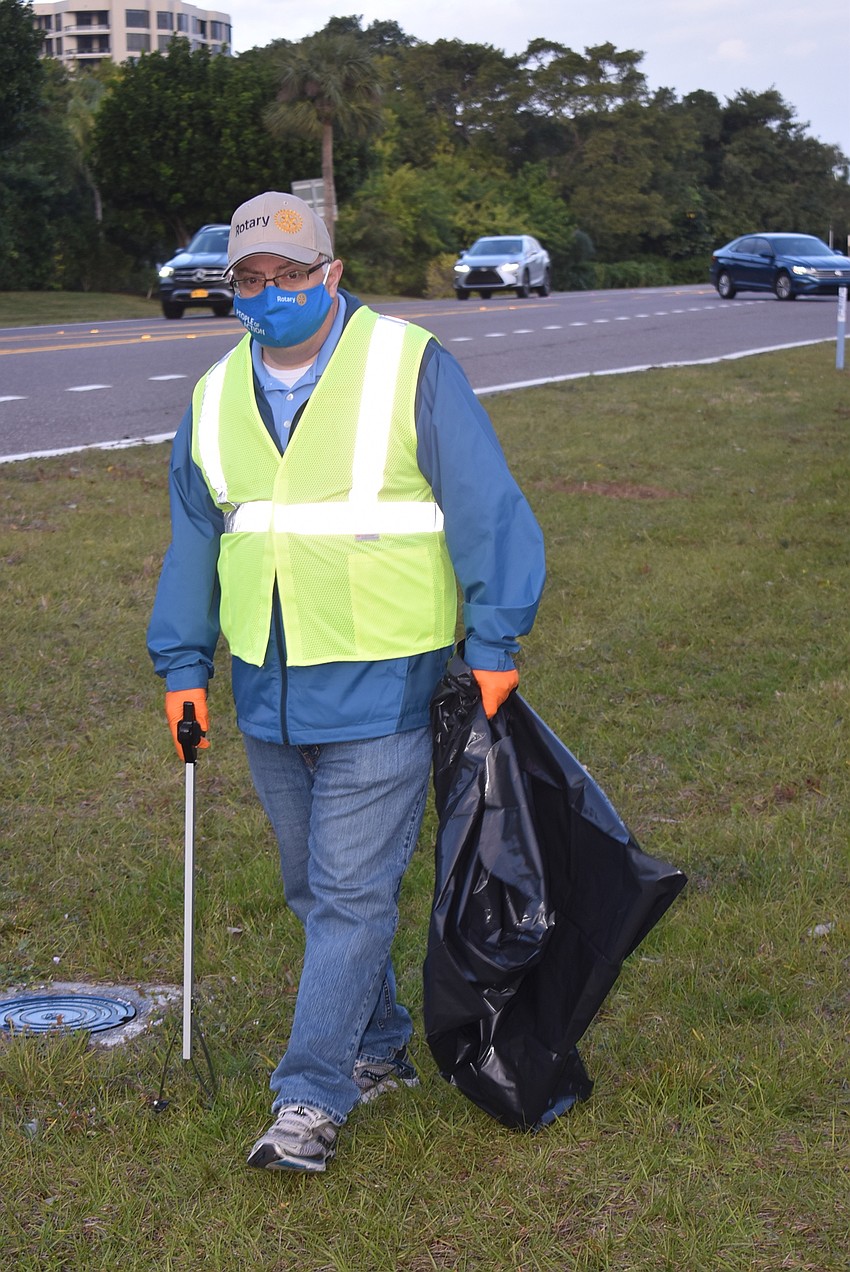 Brad Marner is fully outfitted for trash pickup.