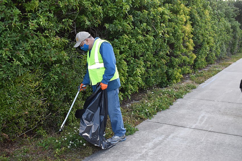 Club President Brad Marner walks along Gulf of Mexico Drive near Country Club Shores.