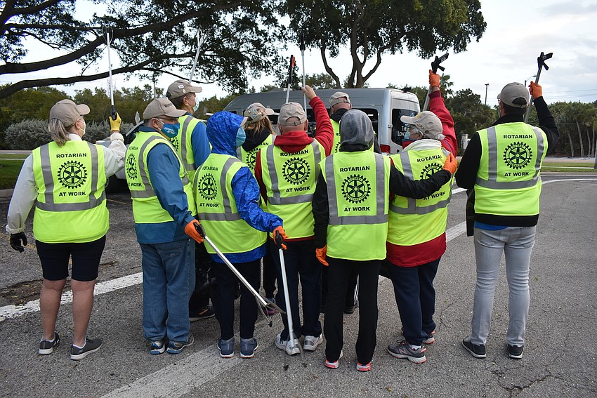 The Rotary Club members met at Chart House to get grabbers and vests.