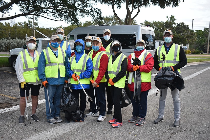 The Rotary Club members met at Chart House to get grabbers and vests.