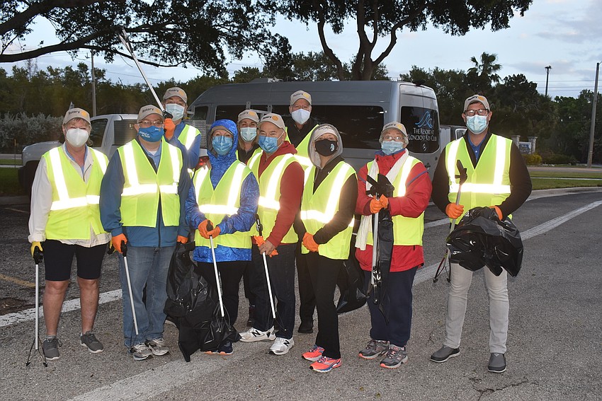 The Rotary Club members met at Chart House to get grabbers and vests.
