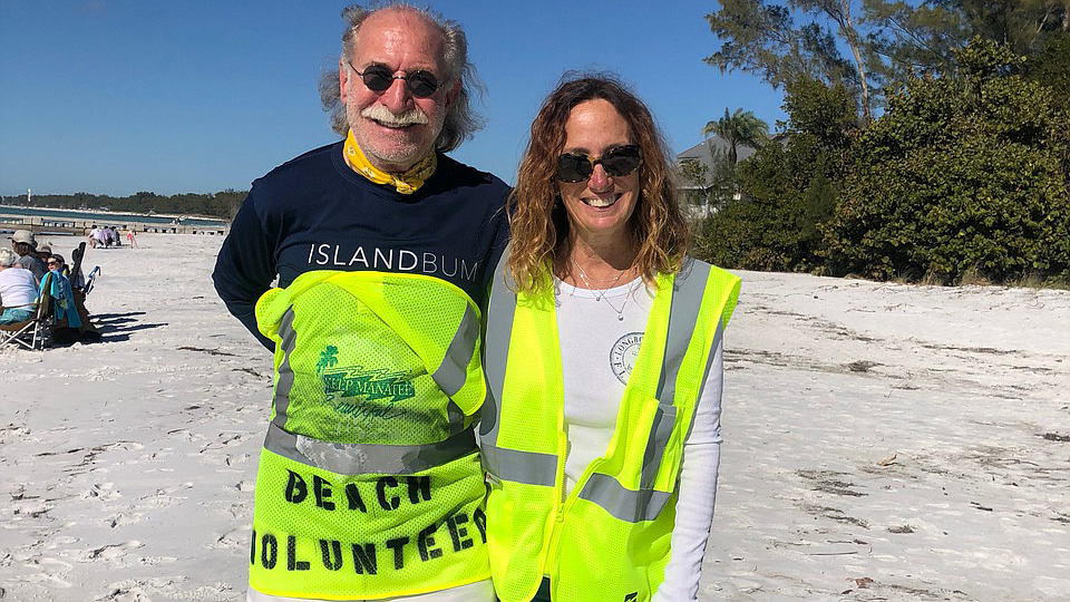 Beach volunteers Michael and Kelly Oâ€™Brien walk along the beach in Longboat Key. Photo Courtesy of Maureen Merrigan