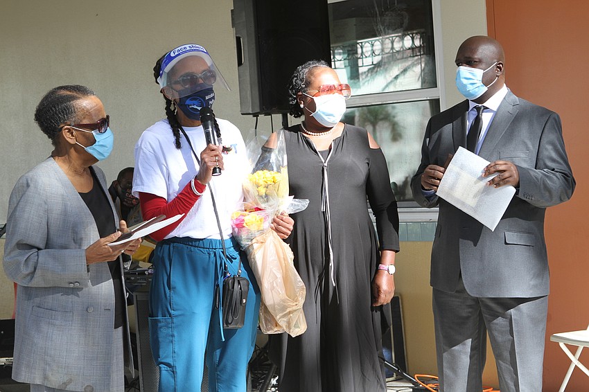 Dr. Lisa Merritt presented the award winners with flowers and gifts as thanks for their work in the community.