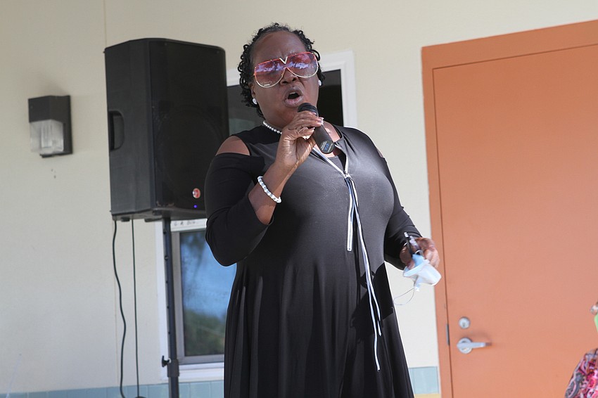 Dr. April Glasco sang loud and proud.