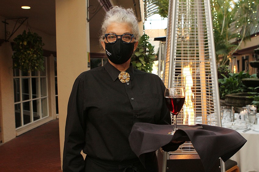 Michael's On East's Tracey McCammack served drinks to guests.