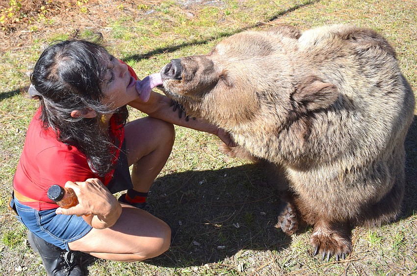 Carol loves giving Monica Welde a kiss.