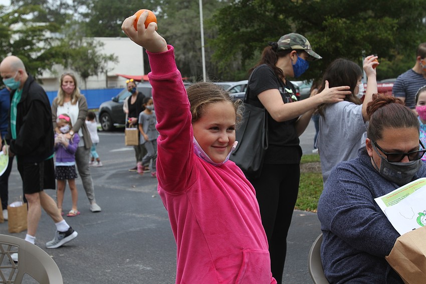 Eloise Friedman held her orange high as part of the holiday.