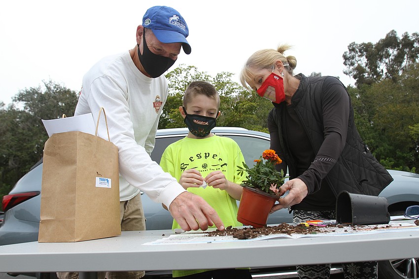 Jimmy, Brooks and Melissa Protigal got to work on their plant.