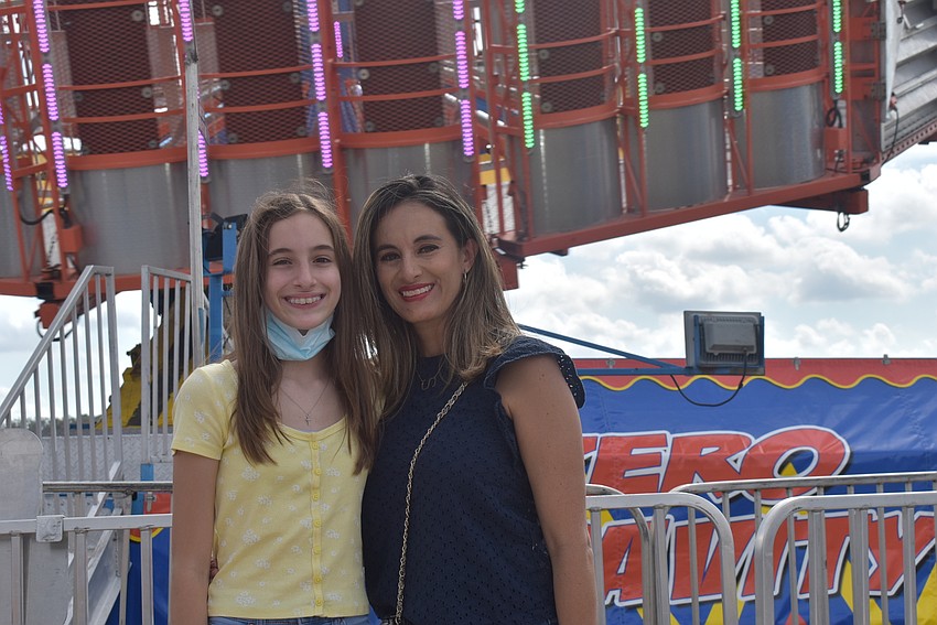 Sarasota residents Sofia Selbeck, 12, and Sandra Selbeck came to the carnival because they were intrigued by the ferris wheel. Sofia said the zero-gravity ride was fun and more intense than she expected.