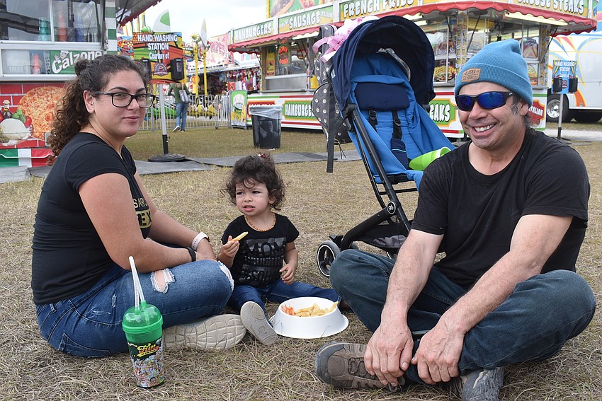 Tair Vergara, 2-year-old Alma Vergara and Omar Vergara came to the carnival from Venice. Alma had never been to one before, so she rode the teacups and carousel.