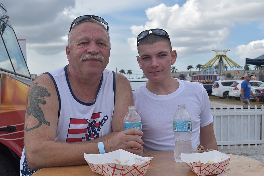 Ellenton resident Frank Nemeth and Kadien Delong, who is visiting from upstate New York, both tried the Bugsy barbecue burger from Bacon Boss, which makes burgers with bacon-infused patties.