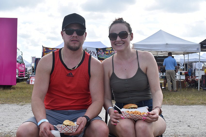 Justin Lavoie and Ferije Lavoie are visiting Sarasota from Cape Coral. They went to Bacon Boss and tried bacon burgers and a side of tater tots covered with mac and cheese and bacon bits.
